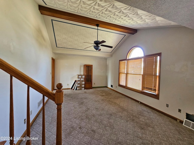 interior space with lofted ceiling with beams, ceiling fan, and carpet floors