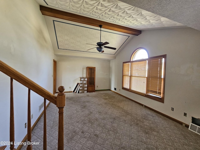 unfurnished living room featuring carpet flooring, vaulted ceiling with beams, and ceiling fan