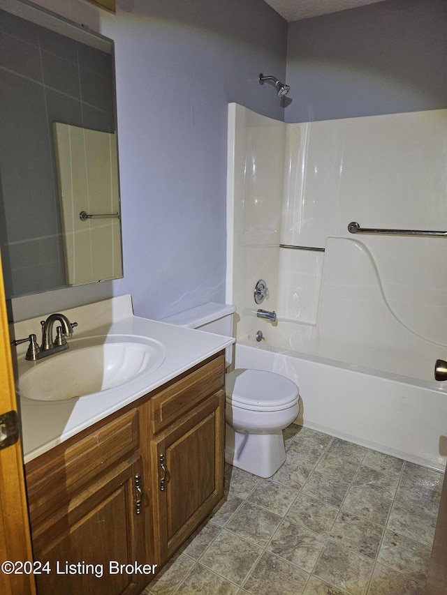 full bathroom featuring vanity, toilet, and  shower combination