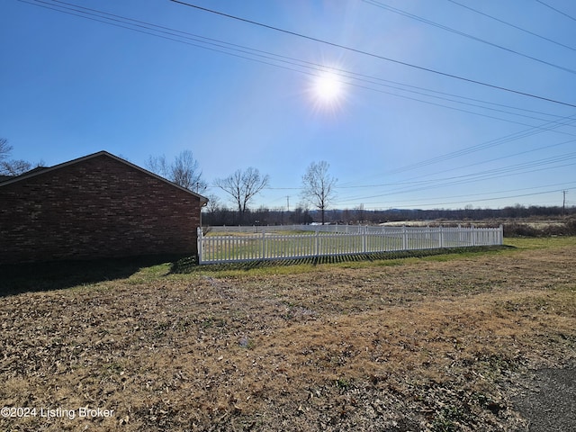 view of yard with a rural view