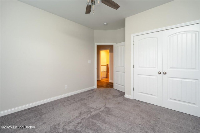 unfurnished bedroom with carpet flooring, a closet, and ceiling fan