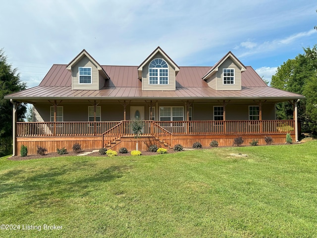 farmhouse inspired home featuring covered porch and a front yard