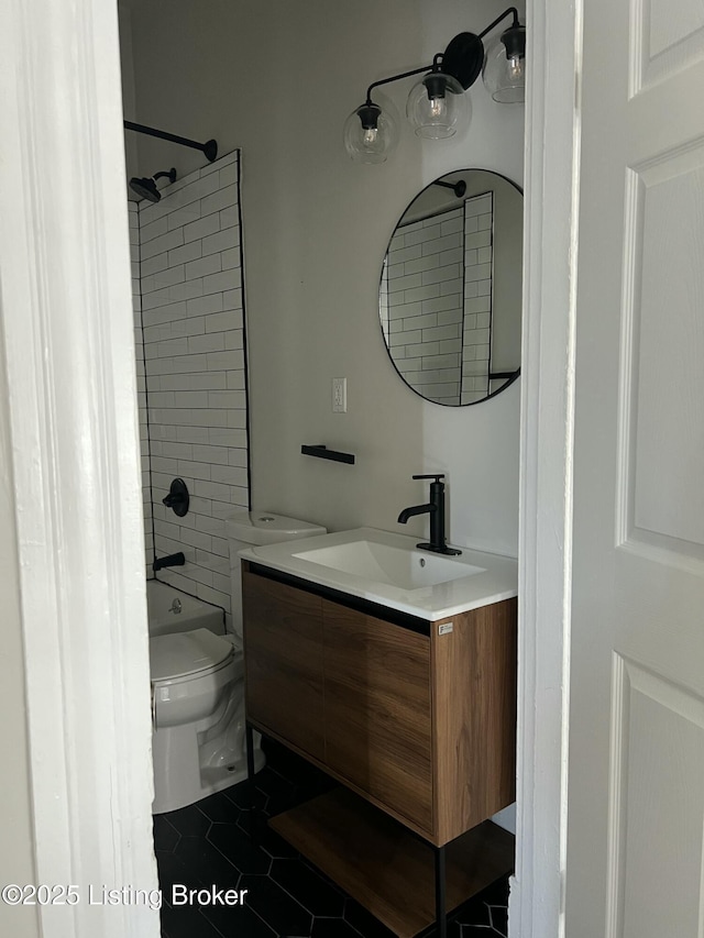 full bath with tile patterned floors, vanity, toilet, and bathing tub / shower combination