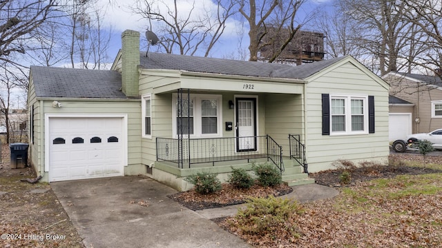 view of front facade featuring covered porch and a garage