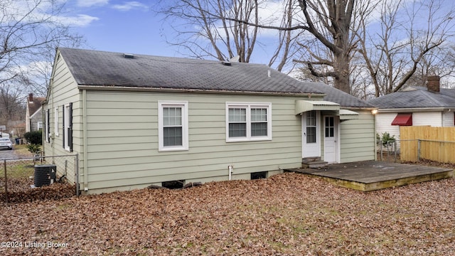 back of property featuring a deck and central air condition unit