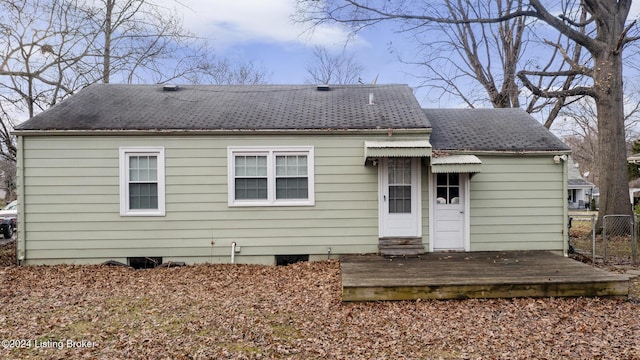 rear view of house featuring a deck