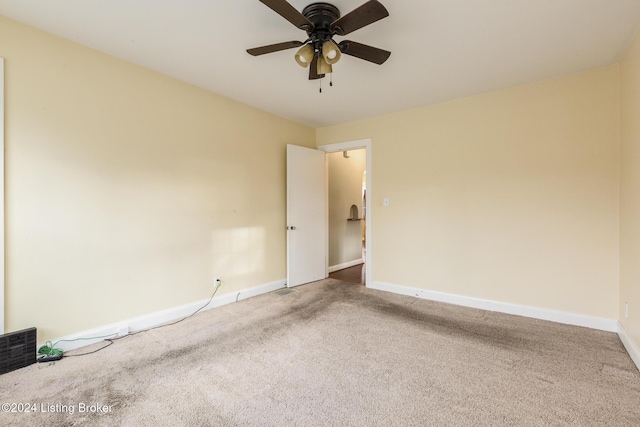 carpeted empty room with ceiling fan