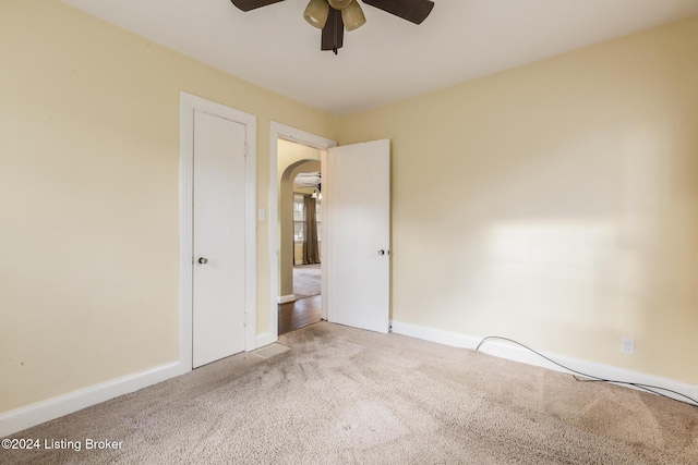 spare room with carpet flooring and ceiling fan