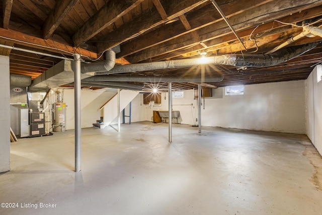 basement with heating unit and water heater