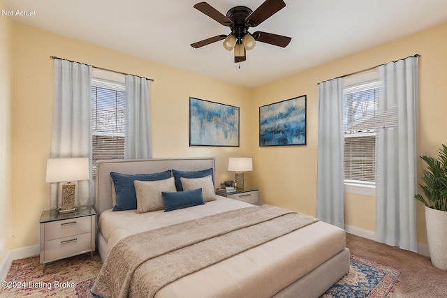 bedroom with ceiling fan and carpet floors