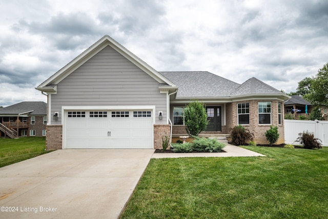 craftsman-style home with a garage and a front lawn