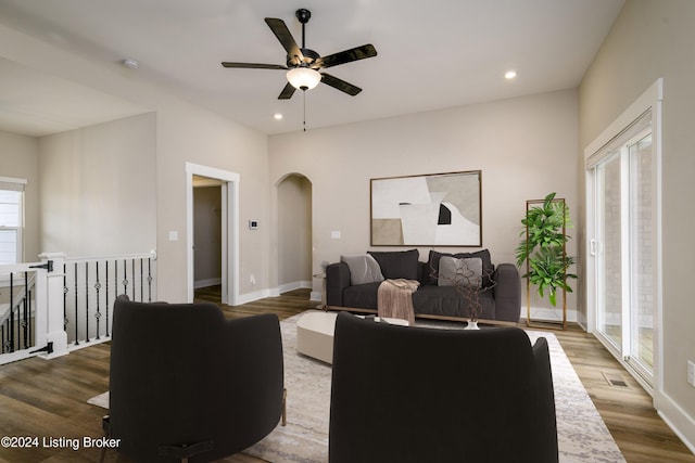 living room with ceiling fan and wood-type flooring