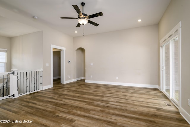 unfurnished room featuring hardwood / wood-style flooring and ceiling fan