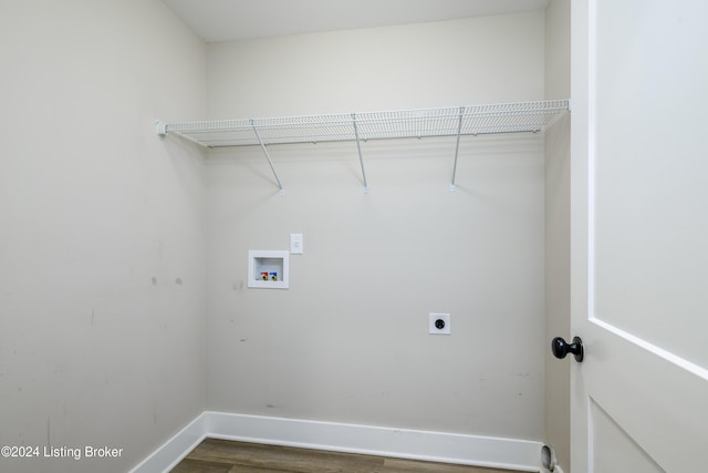 clothes washing area featuring washer hookup, electric dryer hookup, and dark wood-type flooring