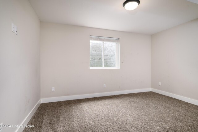 spare room featuring carpet flooring