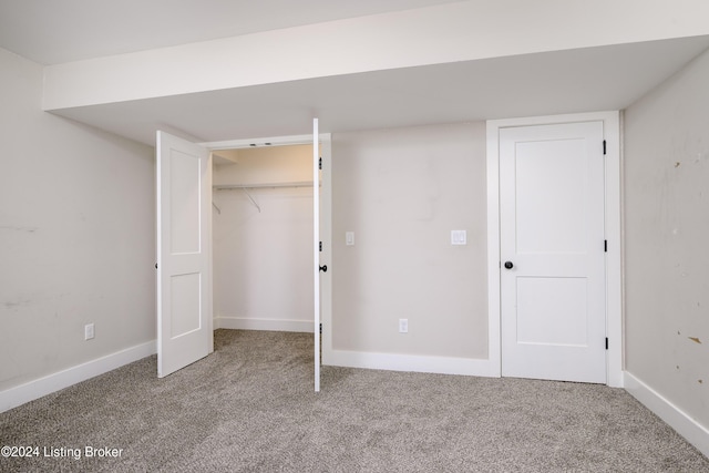 unfurnished bedroom with carpet flooring