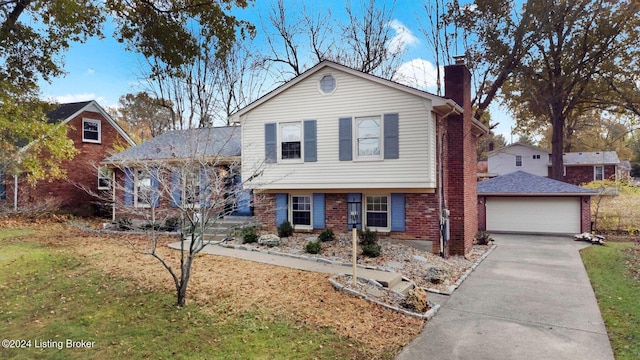 view of front of property featuring a front yard and a garage