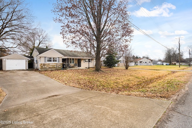 single story home with an outbuilding and a garage