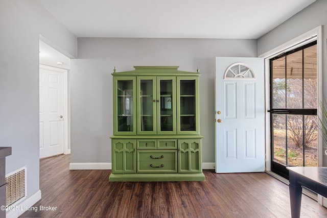 entrance foyer featuring dark hardwood / wood-style floors