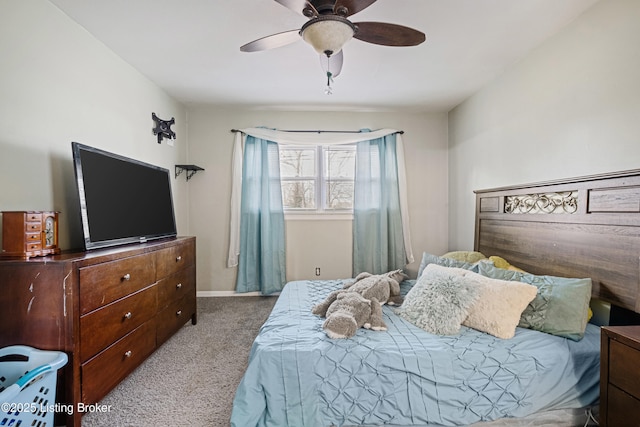 bedroom with ceiling fan and light carpet