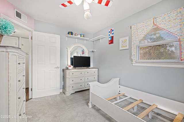 carpeted bedroom featuring ceiling fan