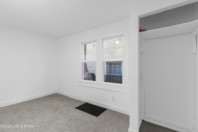 interior space with visible vents and carpet flooring