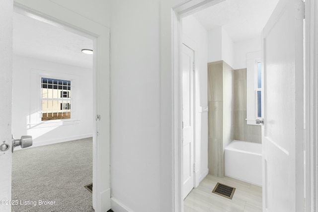 full bathroom featuring a bath and visible vents