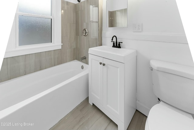 bathroom featuring vanity,  shower combination, and toilet