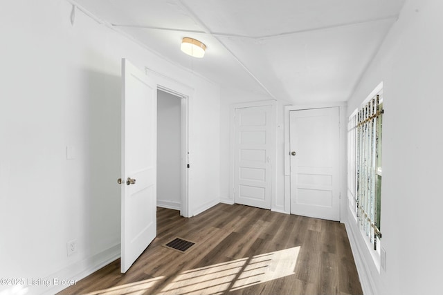 interior space with dark hardwood / wood-style flooring