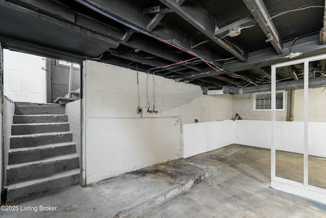 basement featuring stairs