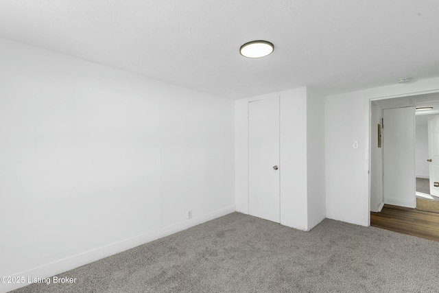 unfurnished bedroom featuring a closet and carpet floors