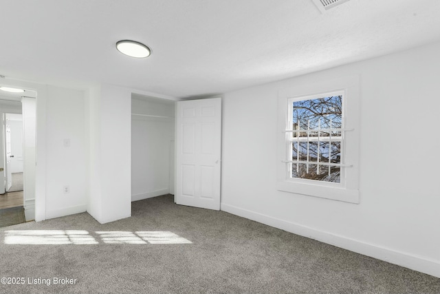 unfurnished bedroom featuring a closet and carpet