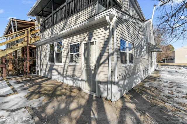 view of home's exterior with a balcony