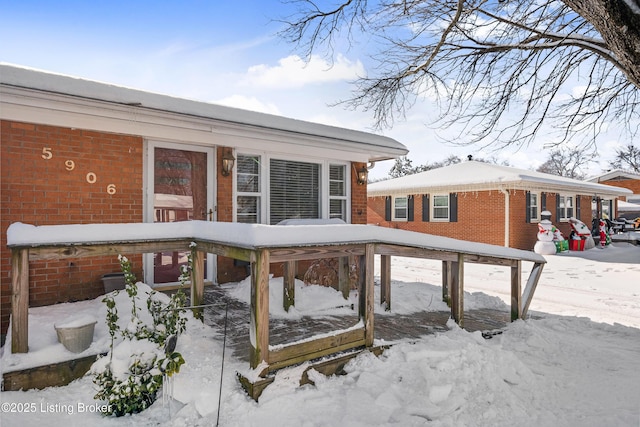 view of snow covered deck