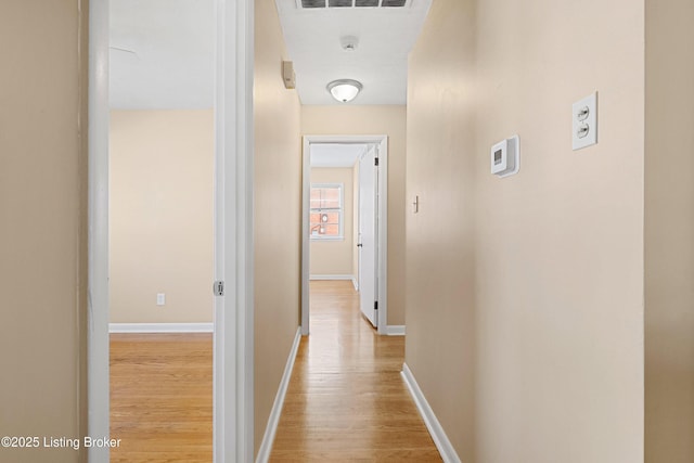 corridor featuring light hardwood / wood-style floors