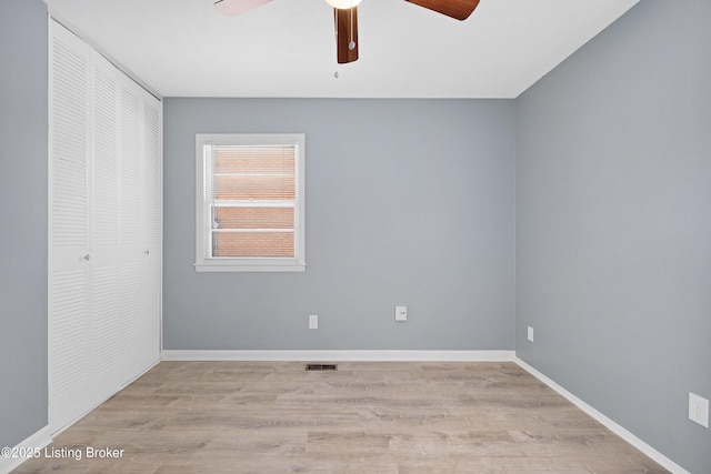 unfurnished room featuring light hardwood / wood-style floors and ceiling fan