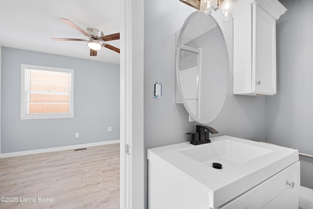 bathroom featuring wood-type flooring and vanity