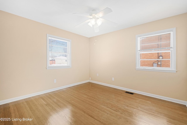 unfurnished room with ceiling fan and light hardwood / wood-style floors