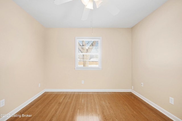 unfurnished room with hardwood / wood-style floors and ceiling fan