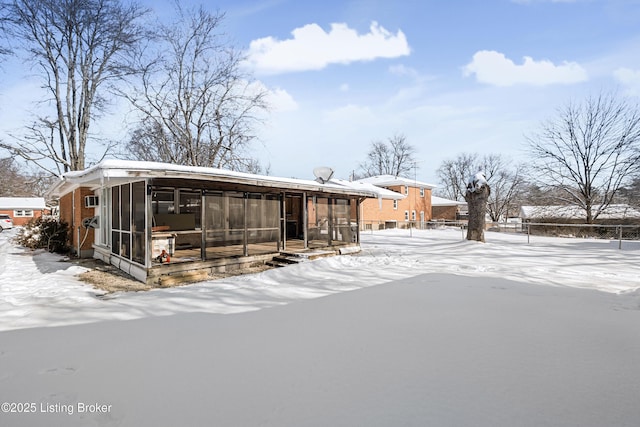 view of snow covered house