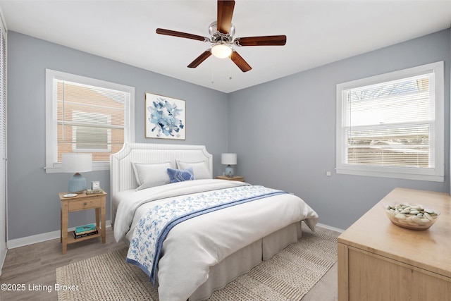 bedroom featuring light hardwood / wood-style flooring and ceiling fan