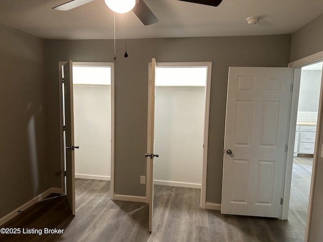 1727 Lytle St, Louisville, KY 40203 - unfurnished bedroom with dark wood-style flooring and ceiling fan