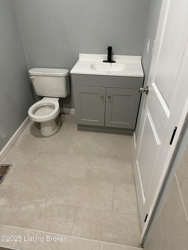 1727 Lytle St, Louisville, KY 40203 - half bathroom with vanity and tile patterned flooring