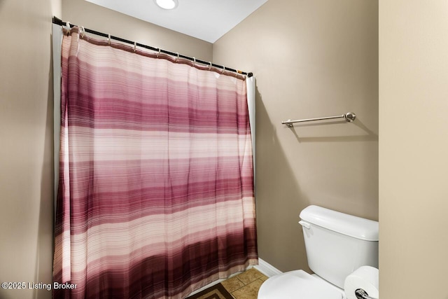 bathroom with tile patterned floors and toilet