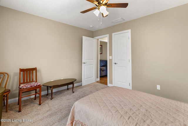 bedroom with ceiling fan and light colored carpet