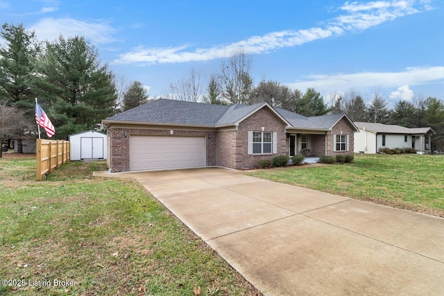 ranch-style home featuring a garage, a front yard, and a storage shed