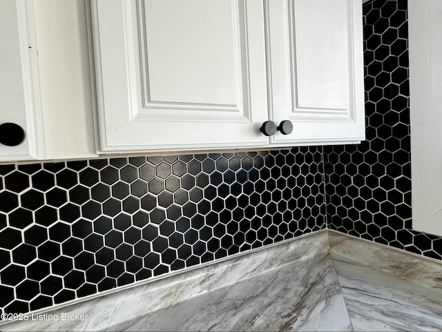 room details featuring decorative backsplash