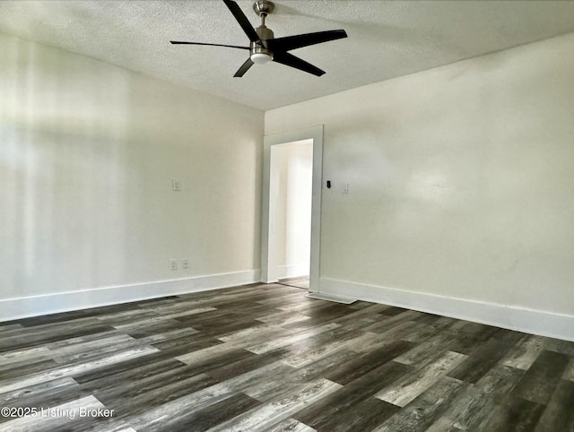 unfurnished room featuring ceiling fan, dark hardwood / wood-style flooring, and a textured ceiling