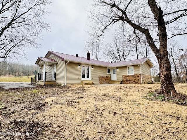 back of property featuring french doors