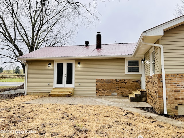 rear view of property with french doors